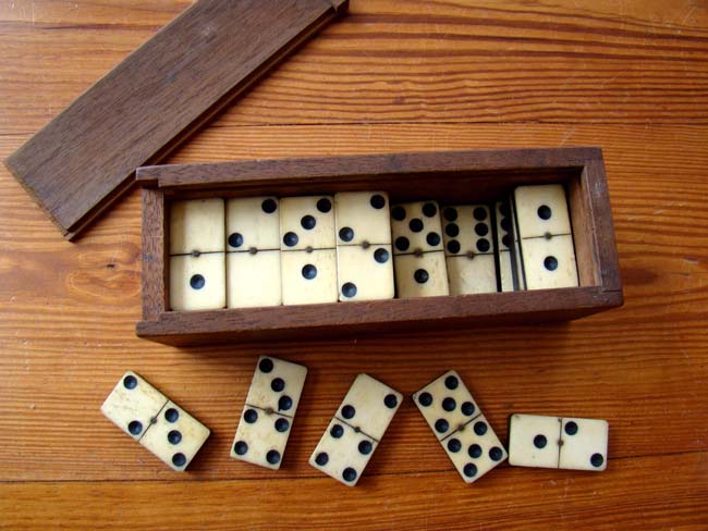 A Civil War era set (28 pieces) of bone and ebony dominoes circa 1860